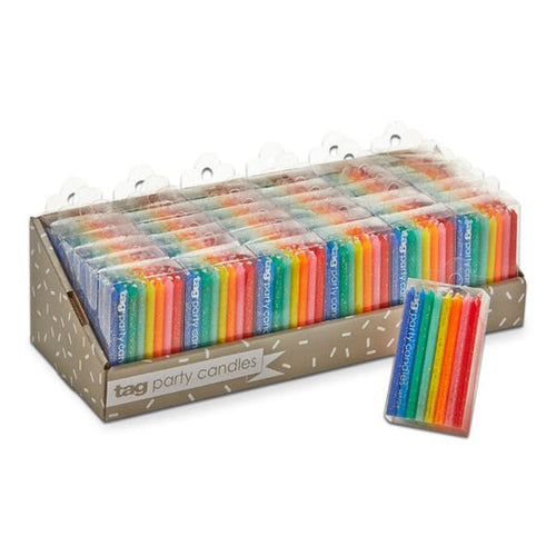 A box of multicolored birthday candles displayed in a variety of colors, ready for use in a birthday celebration.