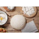 Baking ingredients and tools on a wooden surface