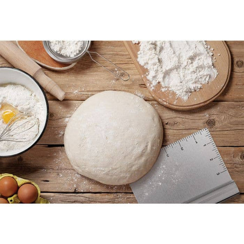 Baking ingredients and tools on a wooden surface