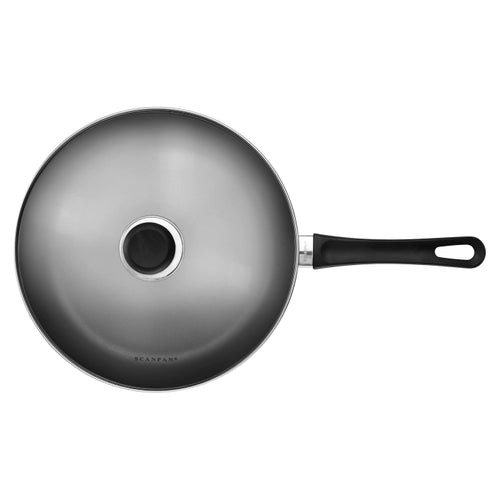 Black frying pan with handle on a white background