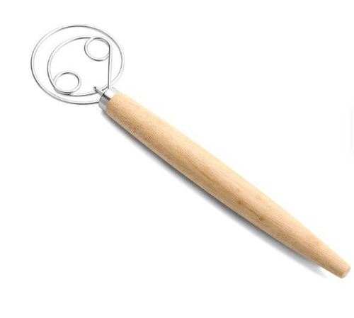 Metallic dough whisk with wooden handle on a white background