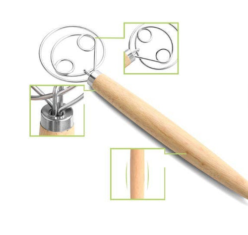 Dough whisk with wooden handle on a white background