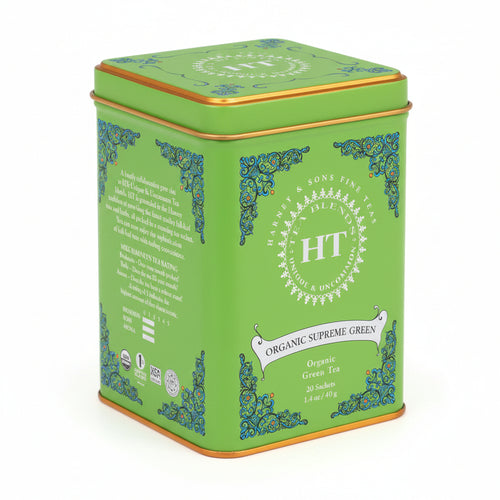 A green tin of Harney & Sons Organic Supreme Green tea with decorative patterns and product information on the label.