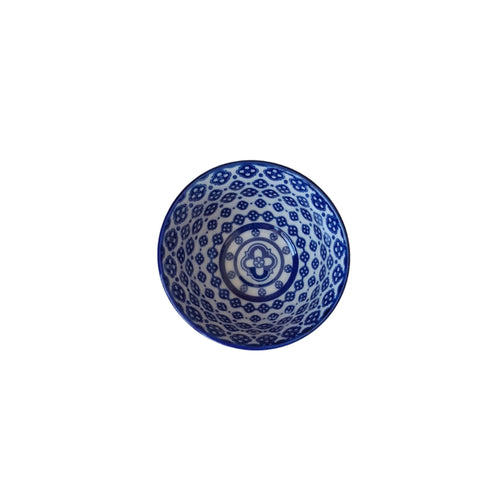 Blue and white patterned bowl on a white background