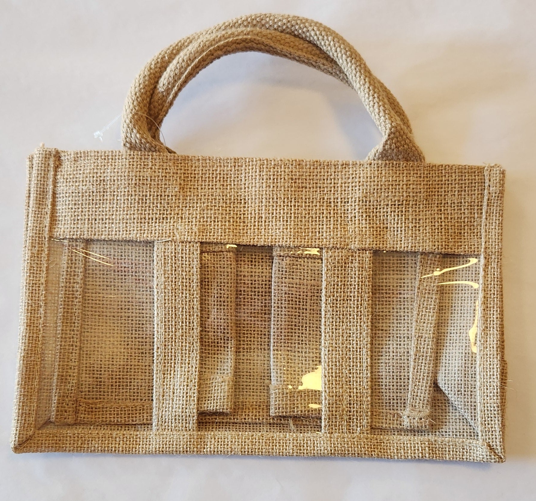 Burlap bag with clear panels on a white background