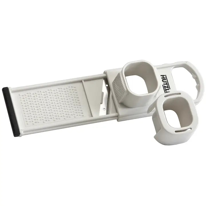 White garlic slicer on a white background