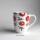 A ceramic mug with floral pattern and 'inky poppies' description underneath.