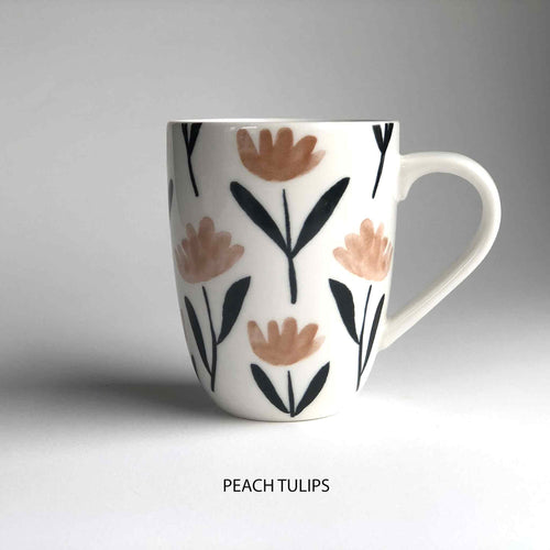 A ceramic mug with floral pattern and 'peach tulips' description underneath.
