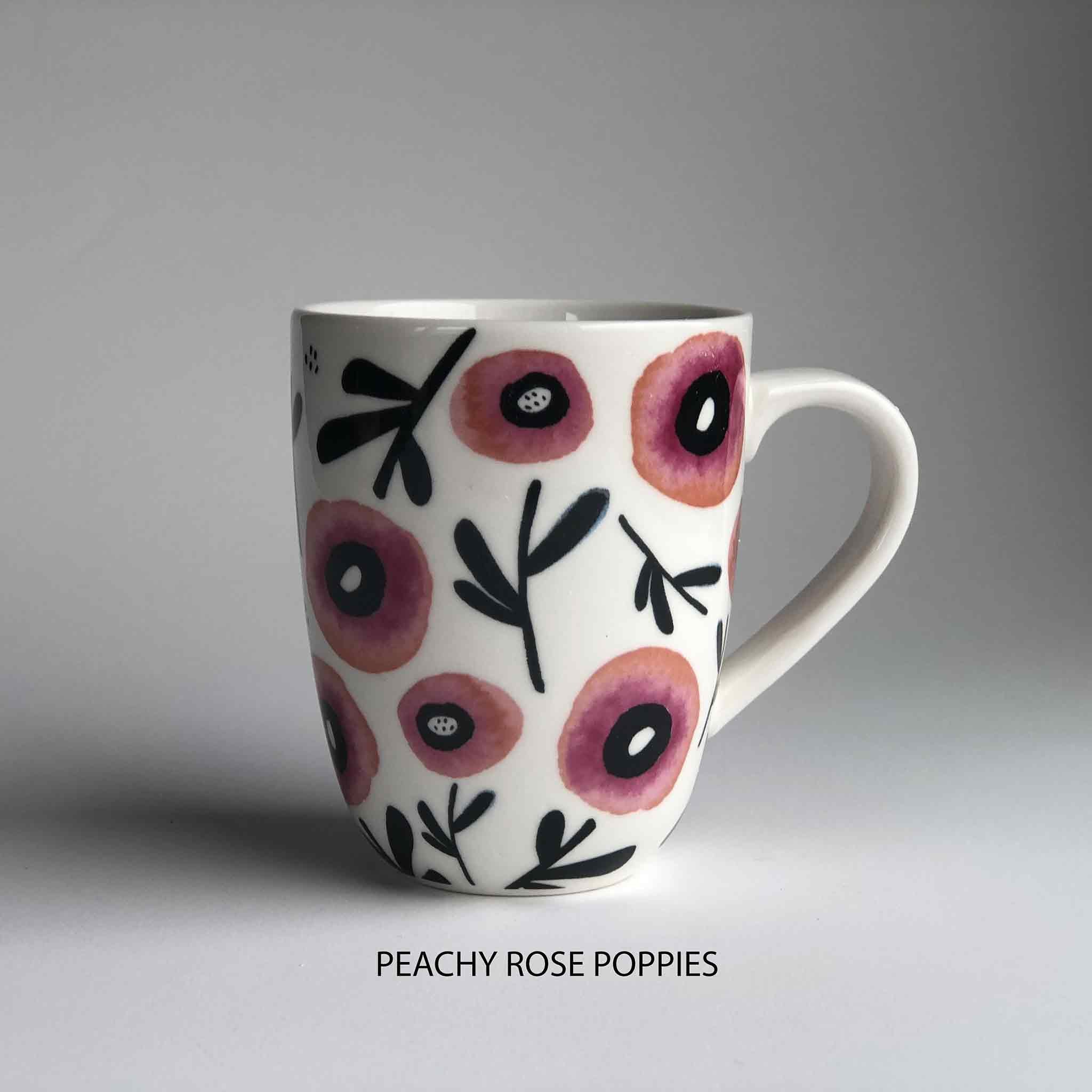 A ceramic mug with pink floral pattern and 'peachy rose poppies' description underneath.