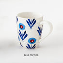 A ceramic mug with blue floral pattern and 'blue poppies' description underneath.