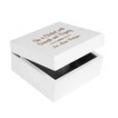 A white jewelry box with a personalized engraving on the lid, featuring text and a name.