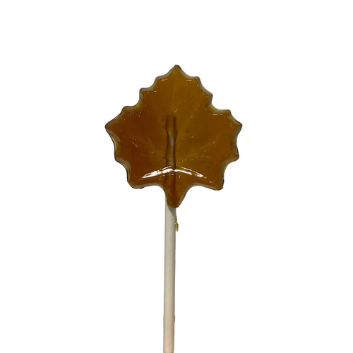 Maple syrup lollipop shaped like a maple leaf on a white background