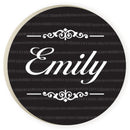 A car coaster with a customized name and decoration