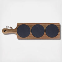 Acacia wood serving board with three circular slate sections for serving, with a handle at one end.
