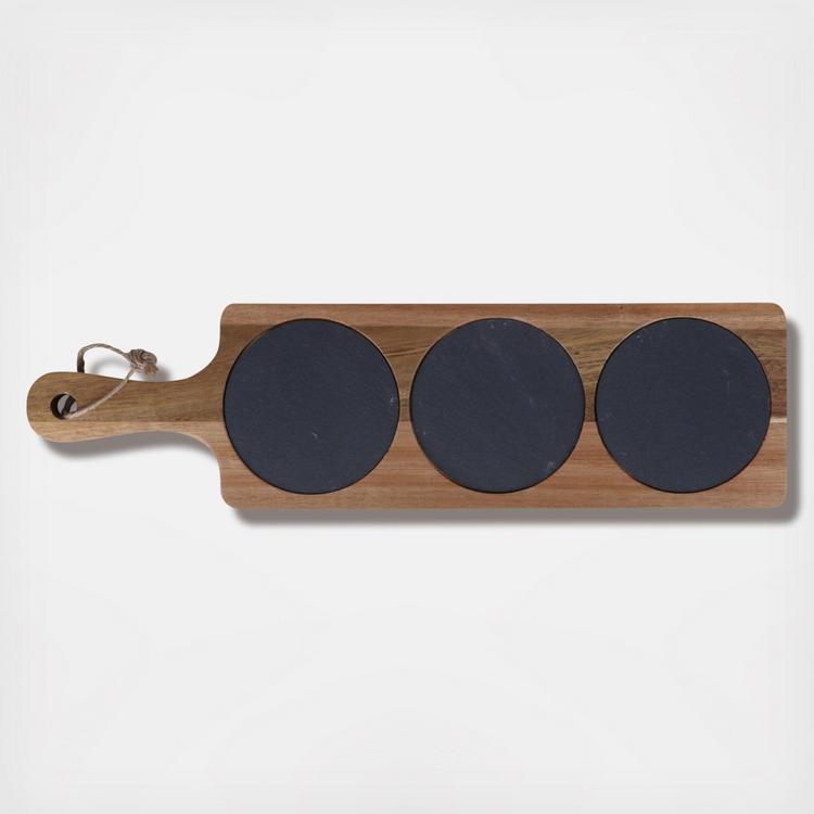 Acacia wood serving board with three circular slate sections for serving, with a handle at one end.