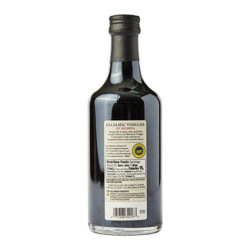 Bottle of balsamic vinegar with label on a white background