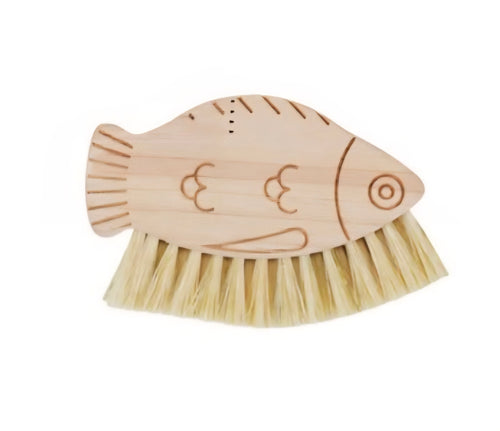 Fish-shaped wooden brush with bristles on a white background