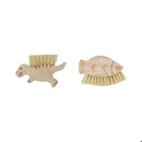 Two wooden brushes shaped like a dinosaur and a fish on a white background