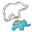 A stainless steel elephant-shaped cookie cutter. Below it, there is a decorated cookie shaped like an elephant.