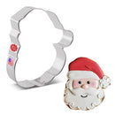 Metal Santa Claus cookie cutter next to a decorated cookie