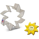 Metal sun-shaped cookie cutter with a yellow sun-shaped cookie on a white background