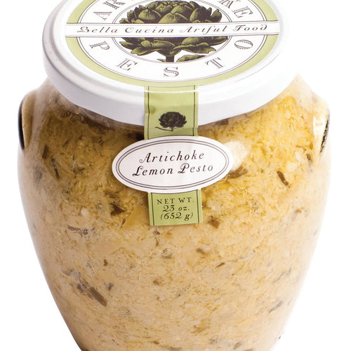 Jar of artichoke lemon pesto with a label on a white background