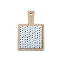 Wooden mini serving board with black and white dots on a white background.