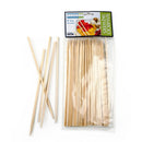 A pack of natural bamboo skewers displayed in front of its packaging which shows a picture of the skewers with food on them.