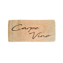 Wooden block with 'Cape Vino' engraving on a dark background