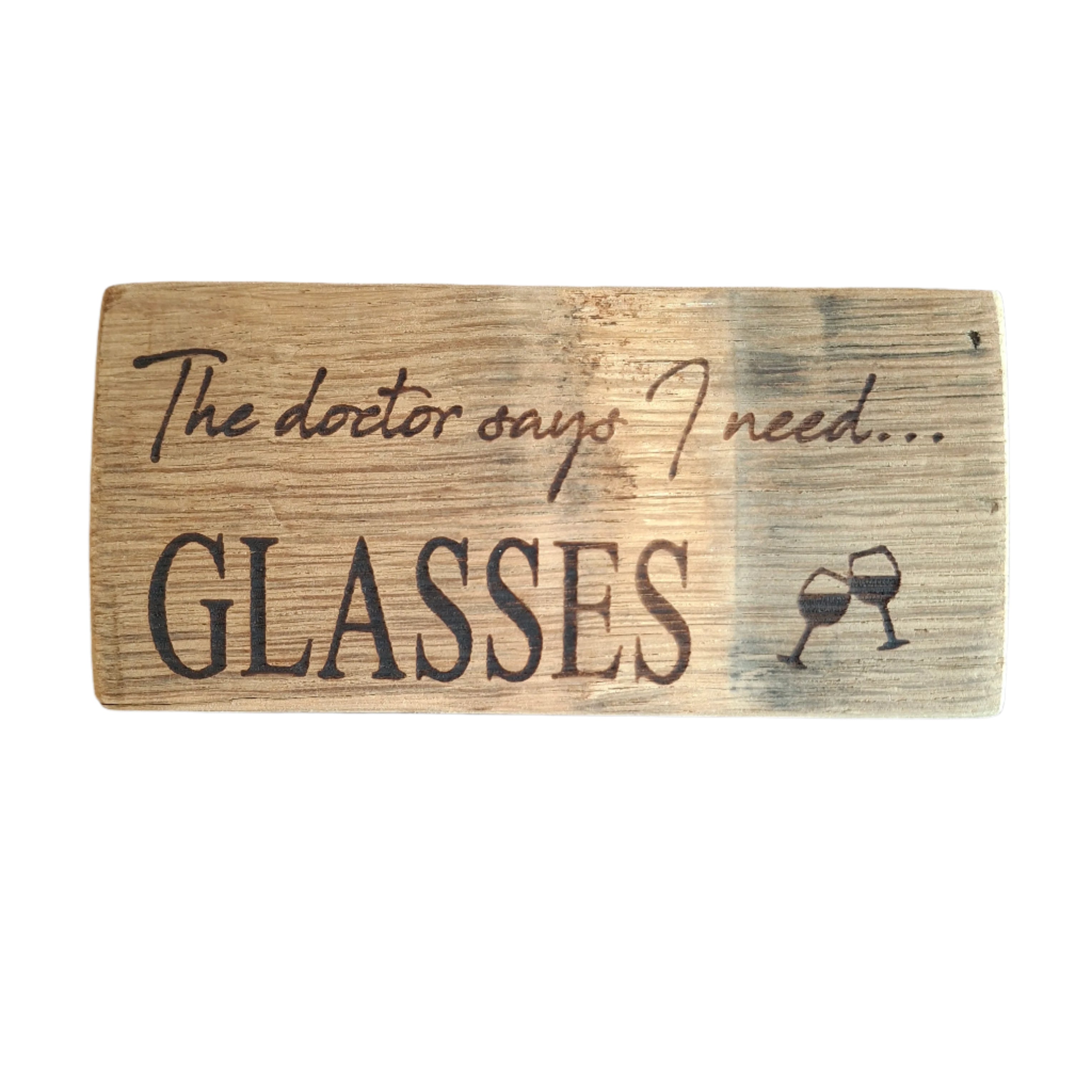 Wooden sign with engraved text and a wine glass symbol on a dark background