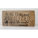 Wooden sign with Hemingway quote on a white background