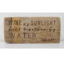 Wooden sign with engraved text on a white background