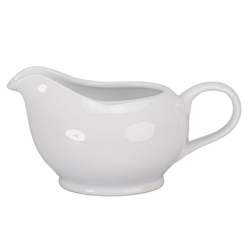 White ceramic gravy boat on a white background