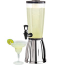 A clear beverage dispenser with a silver base and a black EZ-Pour spigot, alongside a filled glass with a lime slice.