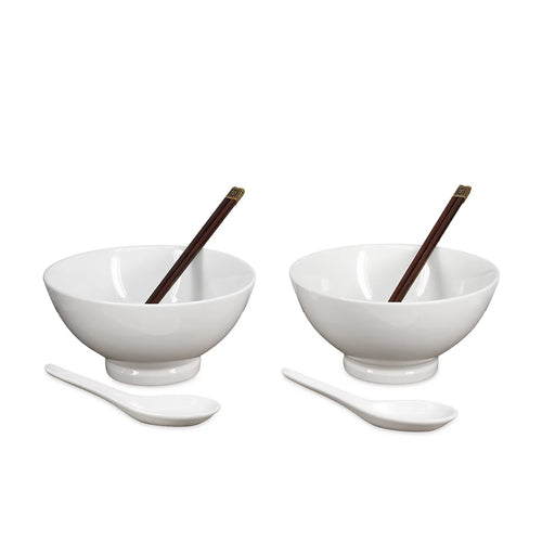 Two white ceramic bowls with matching white spoons and dark brown chopsticks, arranged symmetrically on a plain white background.