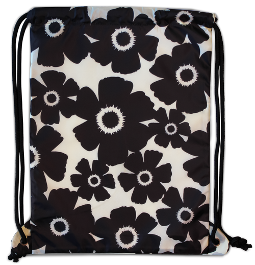 A black and white floral pattern backpack with thick drawstrings and a side zipper pocket.