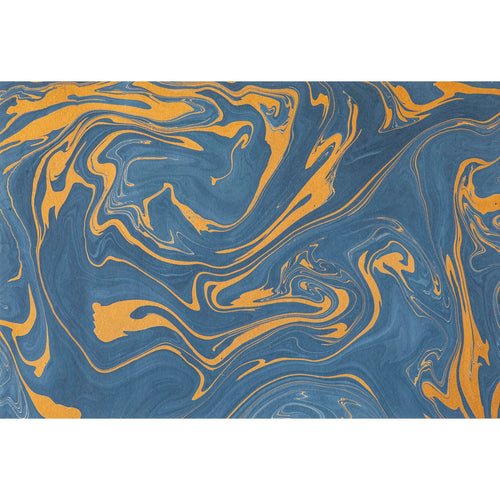 A marbled placemat with blue and gold swirls.