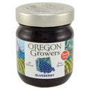 Jar of Oregon Growers blueberry fruit spread with a colorful label on a white background