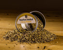 Open container of Bourbon Smoked Citrus Pepper on a wooden surface