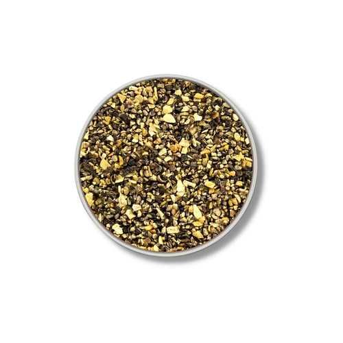 Round container of bourbon smoked citrus pepper on a white background
