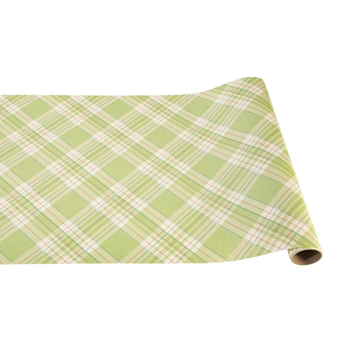A bright green plaid table runner unrolled to show a cheery pattern suitable for spring table settings.