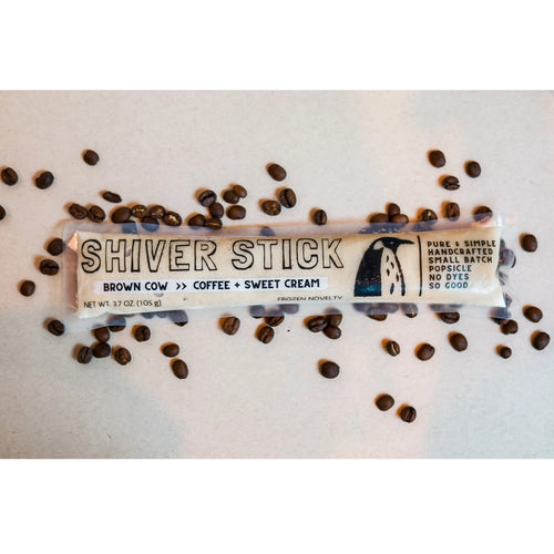 Shiver Stick popsicle packaging with coffee beans on a light background