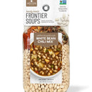 Packaging of California Gold Rush White Bean Chili Mix by Frontier Soups, showing the product and its name, with images of navy beans, sweet potatoes, bell peppers, and artichoke hearts, and a turkey slice, indicating the ingredients and flavors.