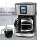 Capresso coffee maker with a glass of coffee on a kitchen counter