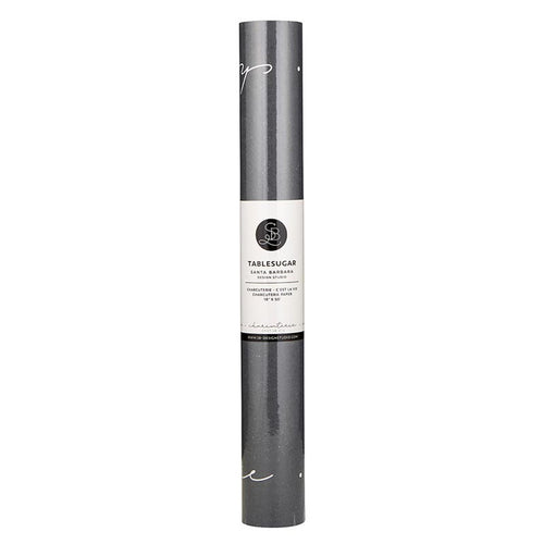 A rolled up charcuterie paper runner with a label that reads 'TABLESUGAR' in a gray color.