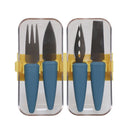 A set of stainless steel cheese knives with blue handles and a container with a gold-colored band.