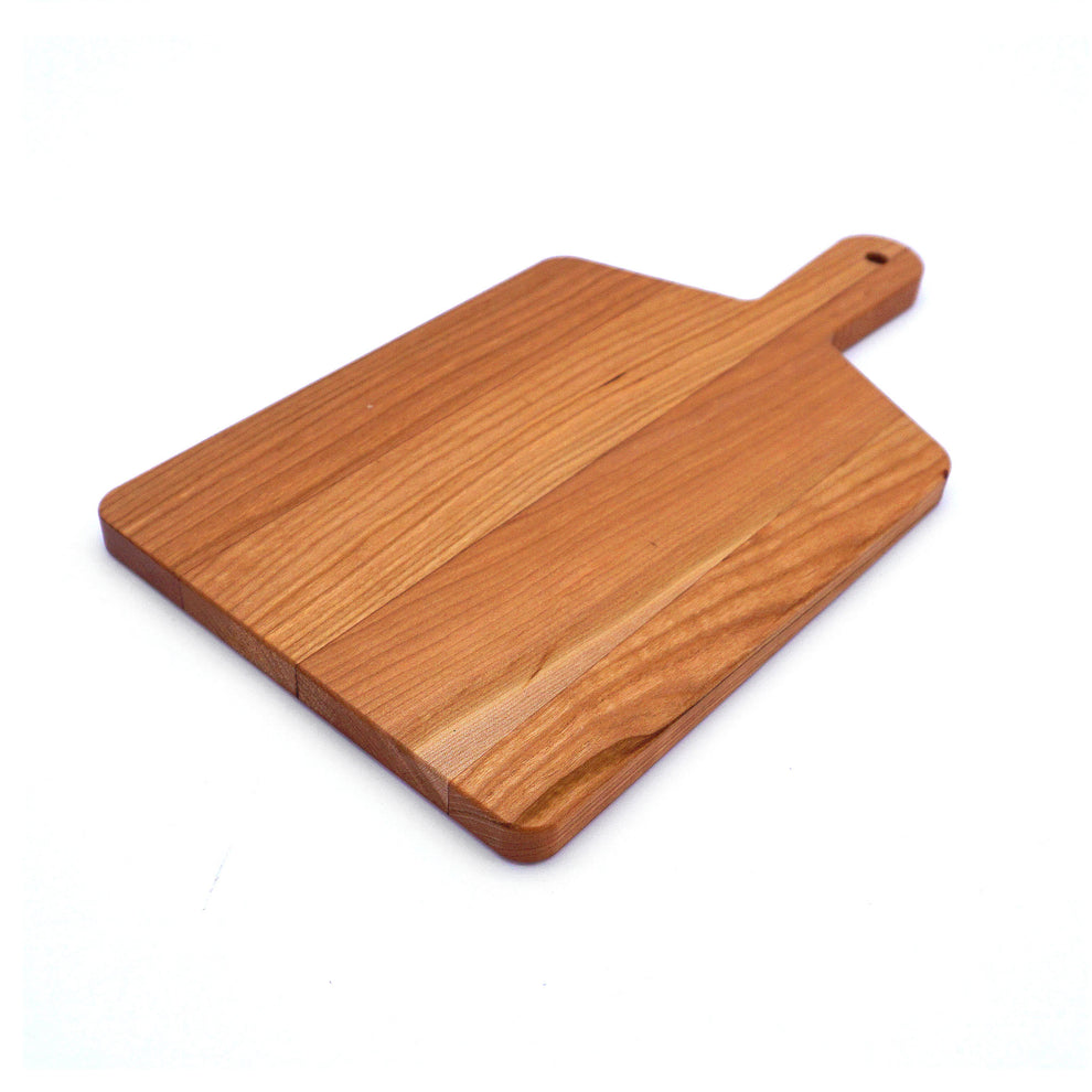 Wooden cutting board with a handle on a white background