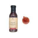 Bottle of chipotle raspberry sauce with a sample on a white background