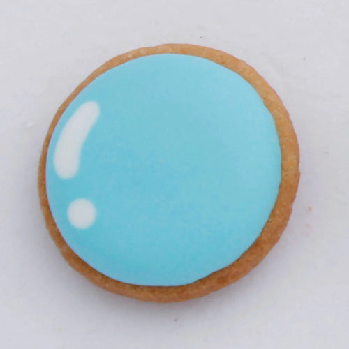 Cookie with blue icing on a white background