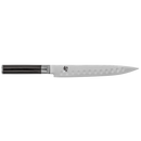 Knife with black handle on a white background